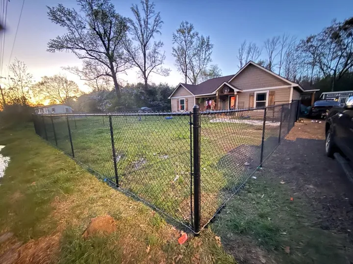 Black chain link yard enclosure: chain link fence in Holden service area