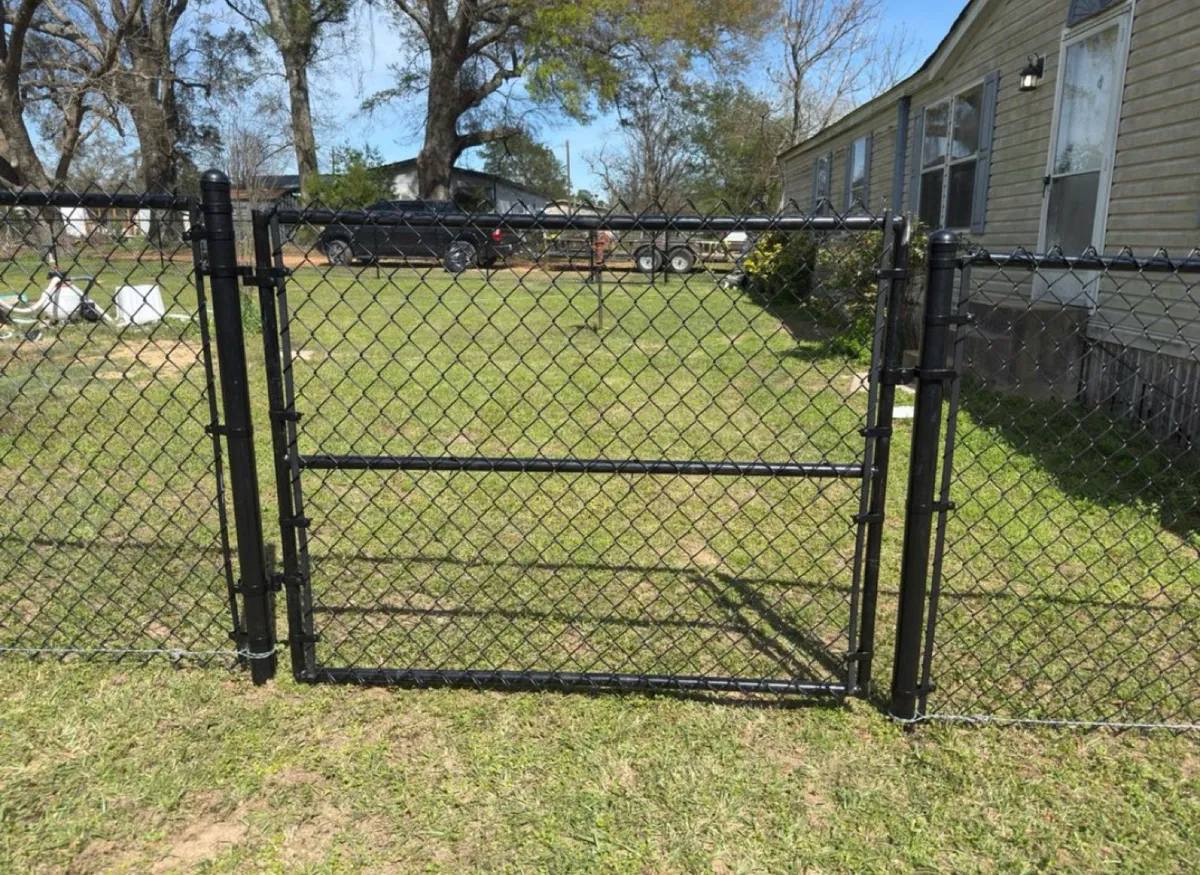 Black chain link run with a matching walk gate