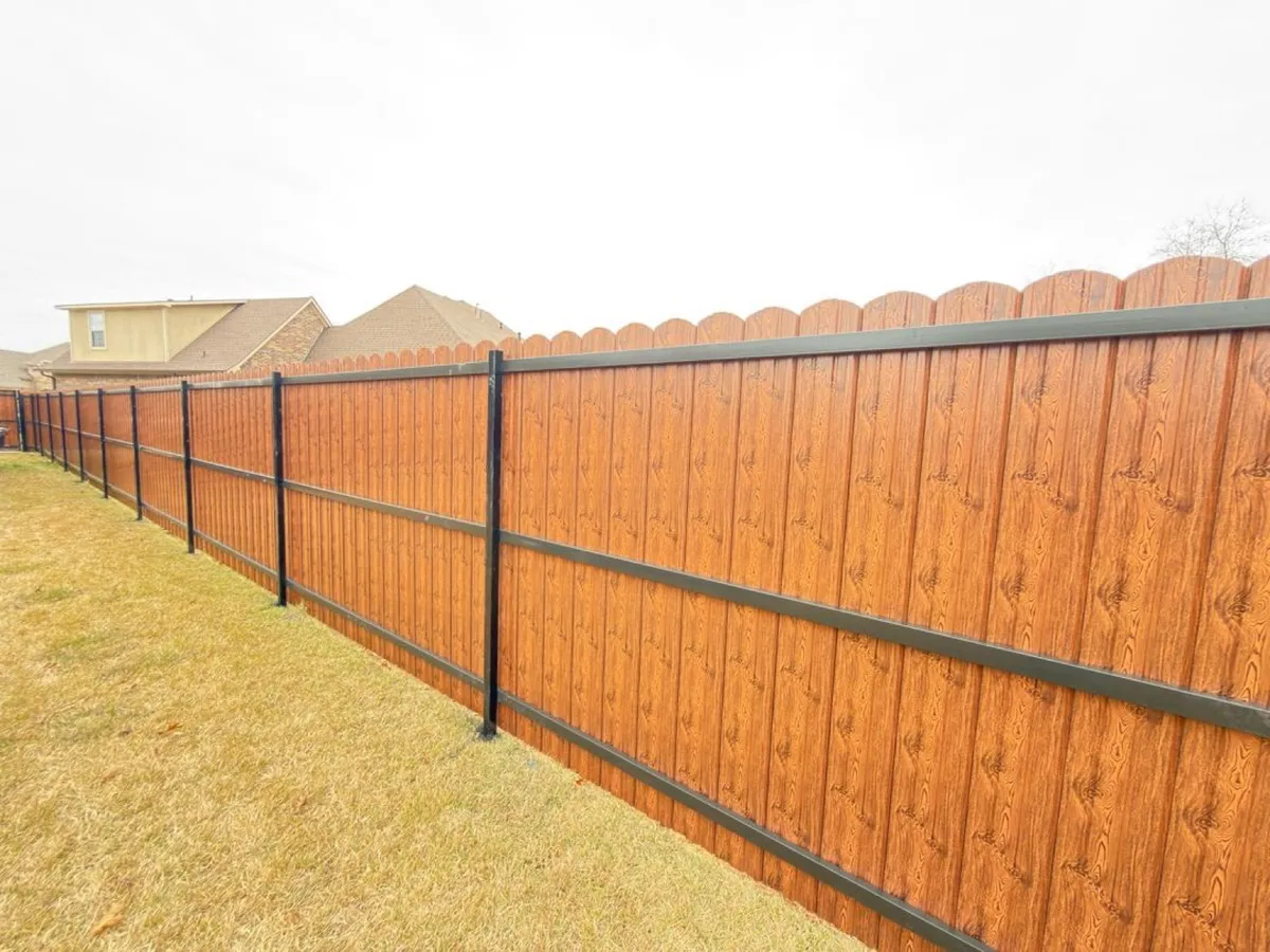 Black powder-coated metal fence panels along a property line