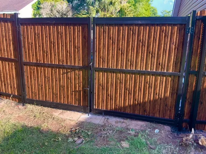 Custom-built double drive gates: gates fence in Holden service area